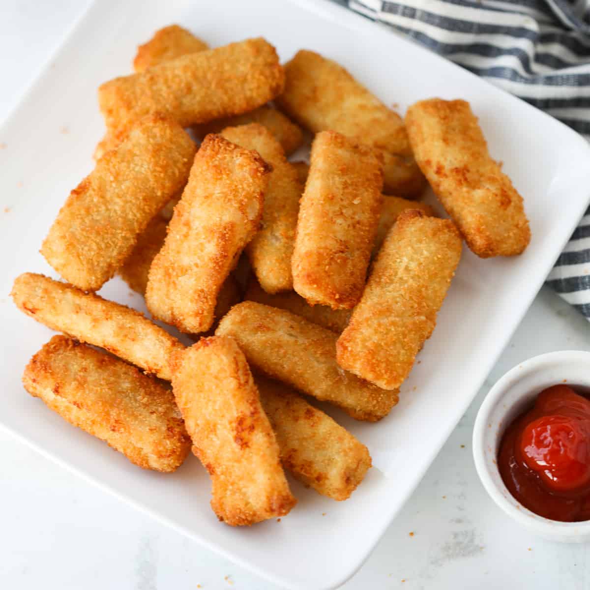 frozen fish sticks in air fryer after cooking with ketchup