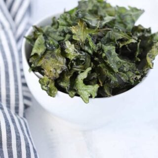 kale chips air fryer recipe served in a white bowl on a white background