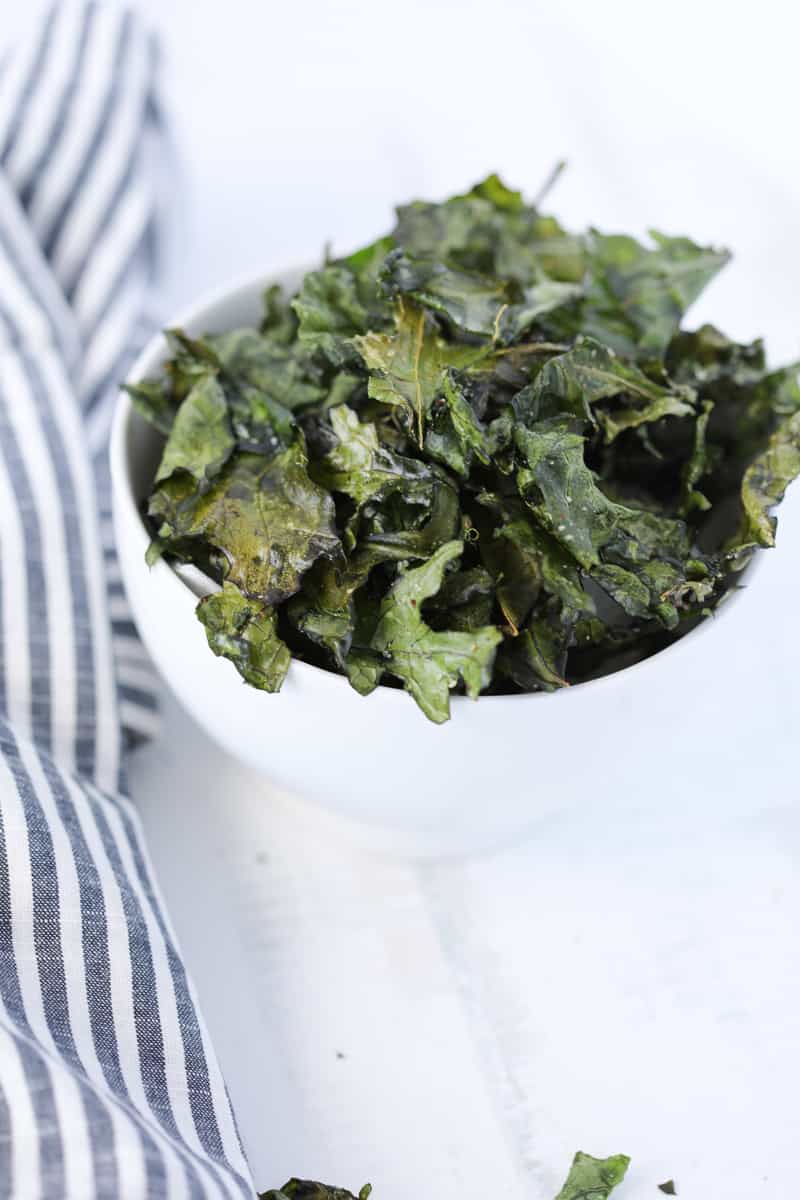 kale chips air fryer recipe served in a white bowl on a white background