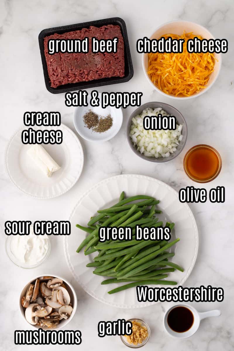 the ground beef green bean casserole ingredients on a white marble board
