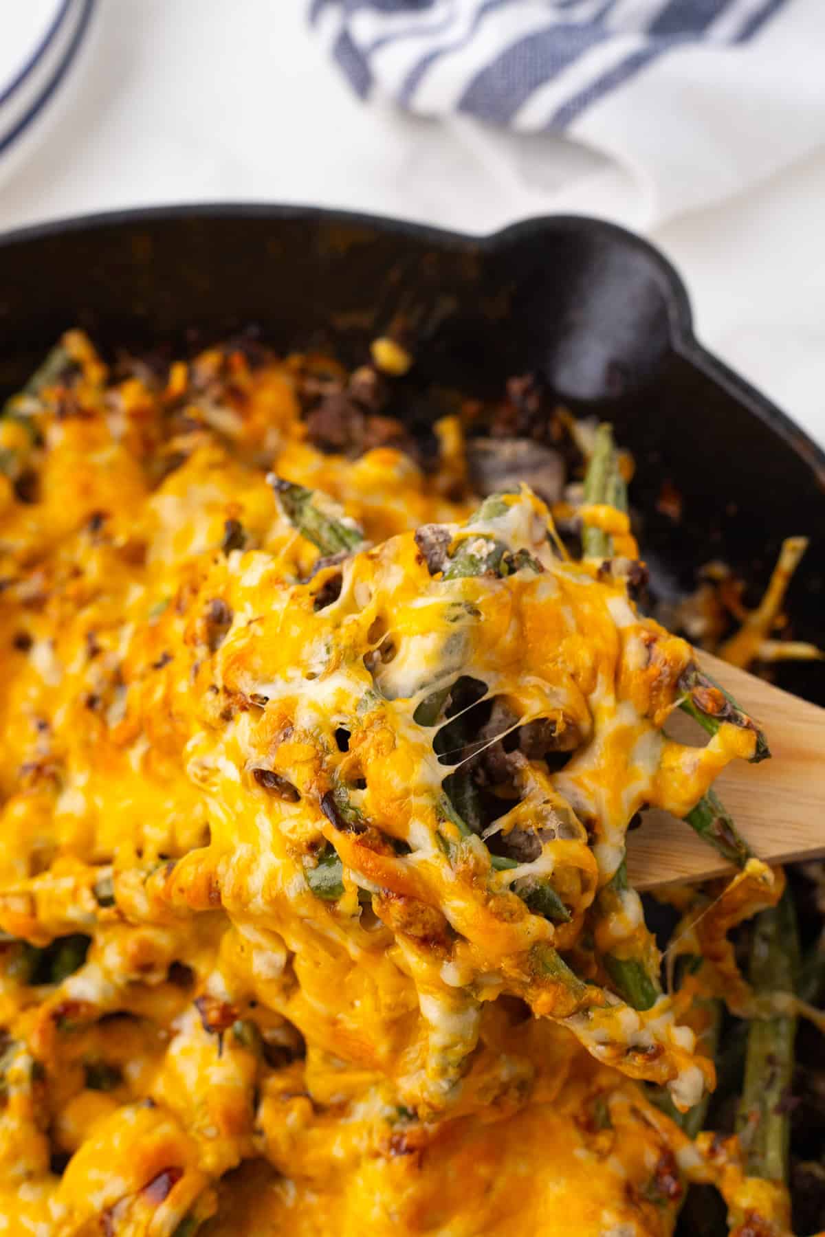 a scoop of the cheesy casserole on a spoon