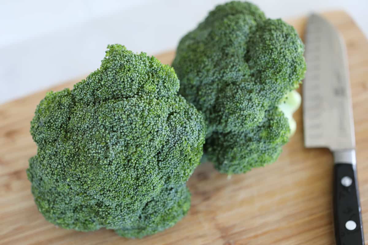 raw broccoli on a cutting board