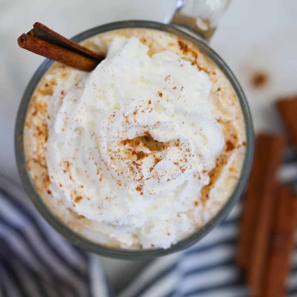 keto pumpkin spice latte Starbucks copycat top down view of whipped cream and pumpkin spice on a mug