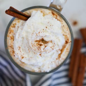 keto pumpkin spice latte Starbucks copycat top down view of whipped cream and pumpkin spice on a mug