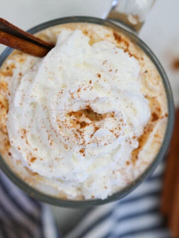 keto pumpkin spice latte Starbucks copycat top down view of whipped cream and pumpkin spice on a mug