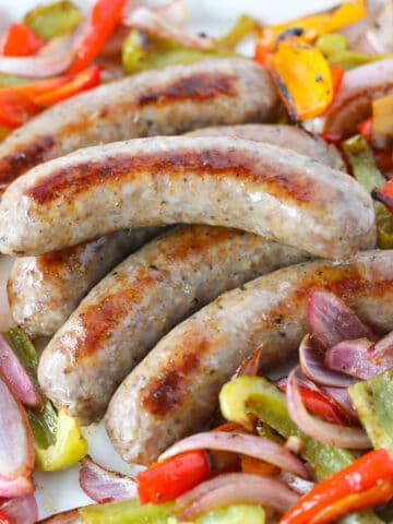 baking brats in the oven with peppers