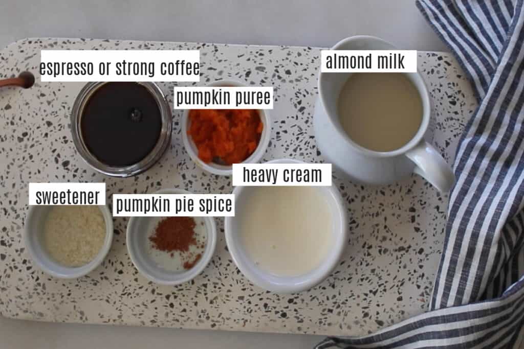 keto pumpkin spice latte recipe ingredients on a cutting board