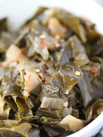 vegan collard greens recipe closeup image with hot sauce