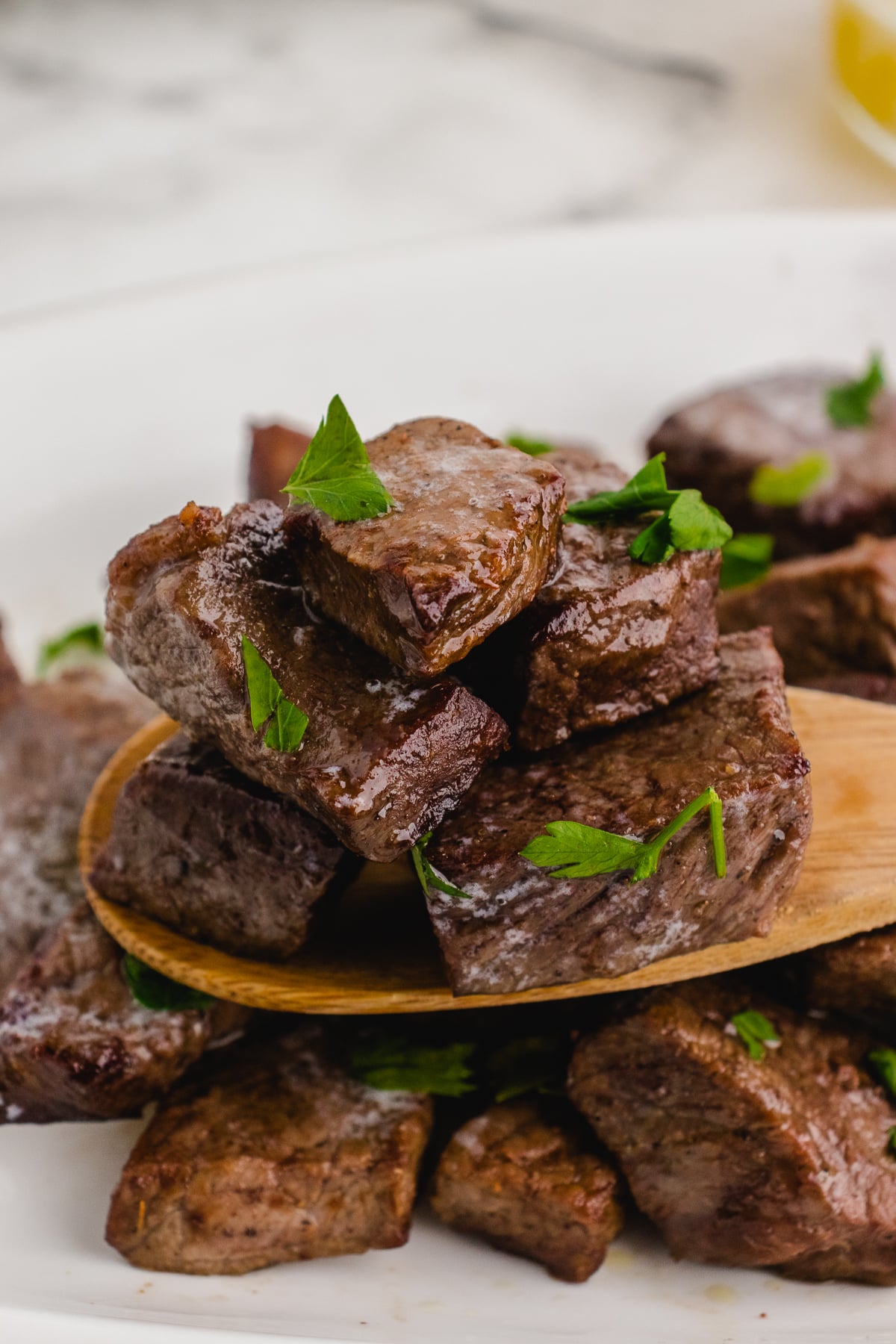 air fryer steak tips on a wooden spoon