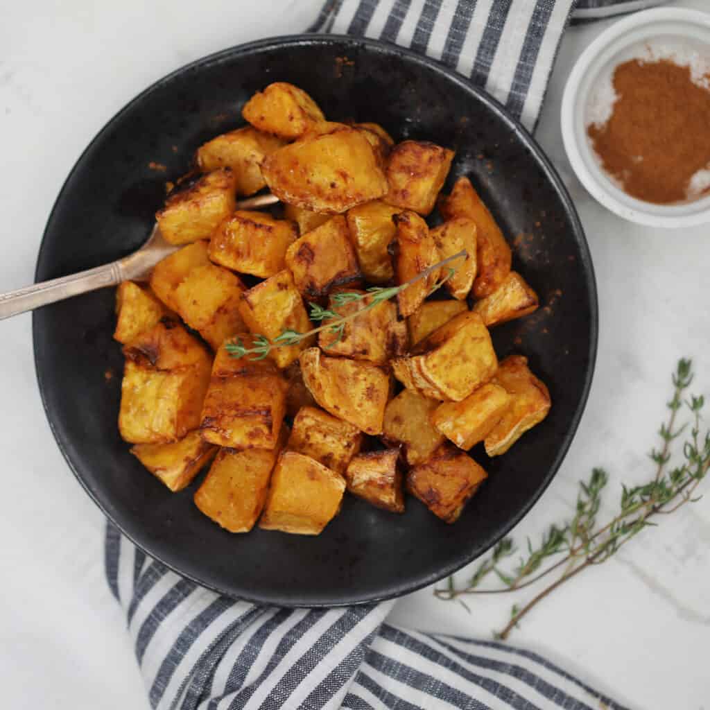 air fryer butternut squash with maple syrup and cinnamon ready to serve
