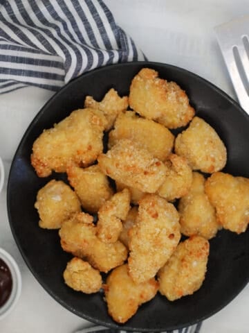 air fryer frozen chicken nuggets next to BBQ sauce