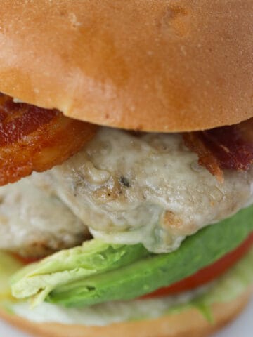 air fryer turkey burgers with lettuce, avocado, bacon, and swiss cheese