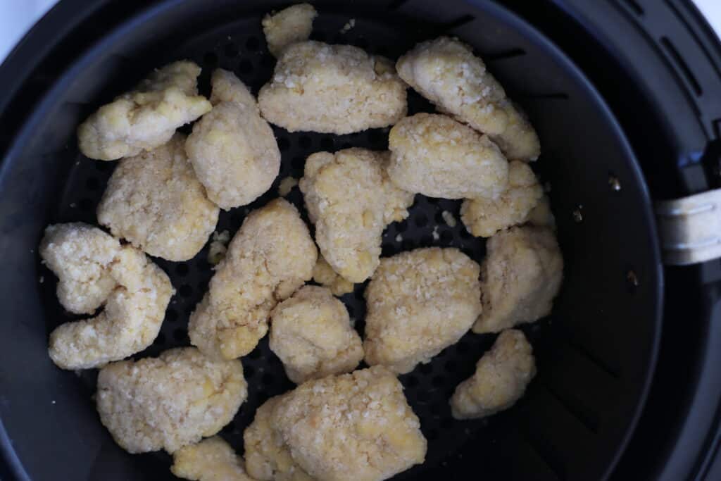 frozen chicken nuggets air fryer before cooking in the basket