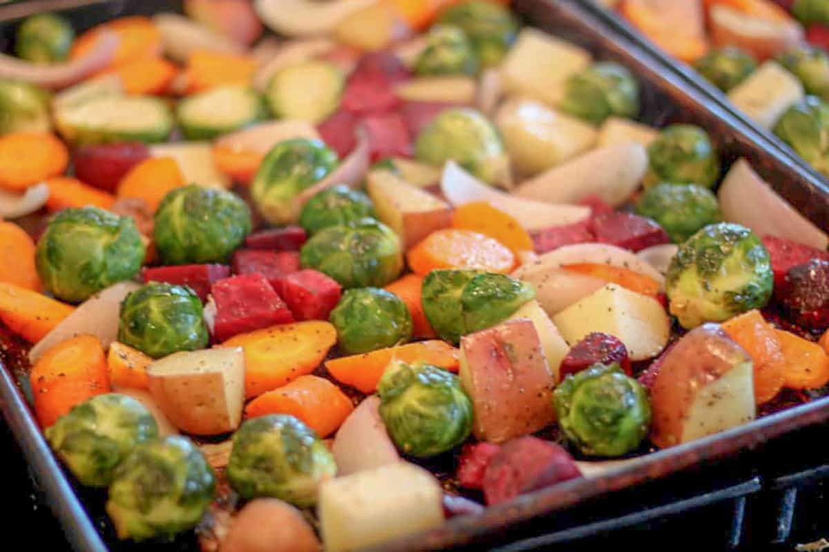 spread the roasted fall veggies between two pans