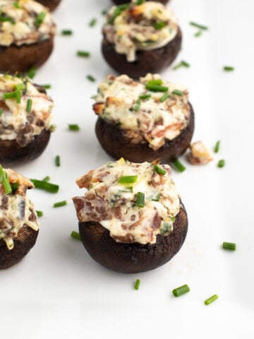 low carb stuffed mushrooms without breadcrumbs on a white plate