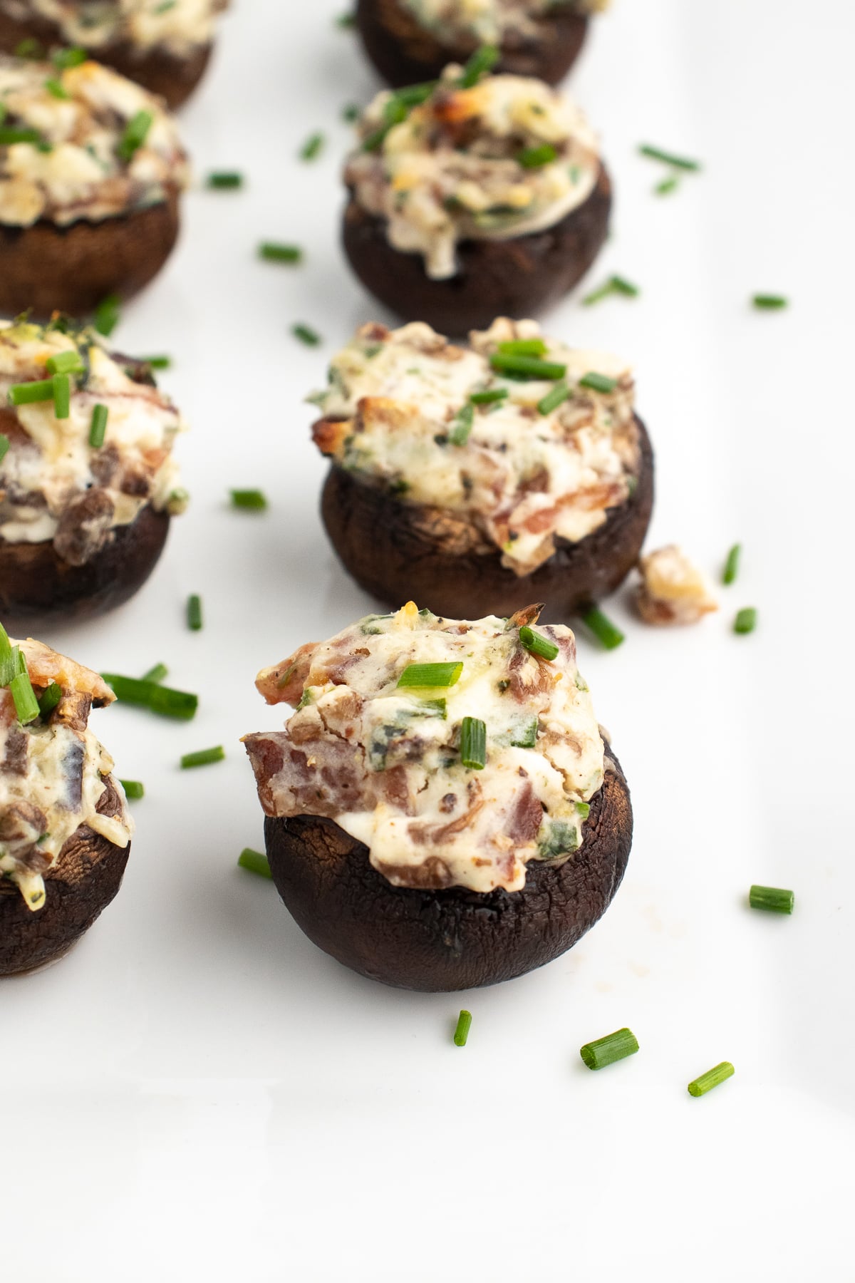 low carb stuffed mushrooms without breadcrumbs on a white plate