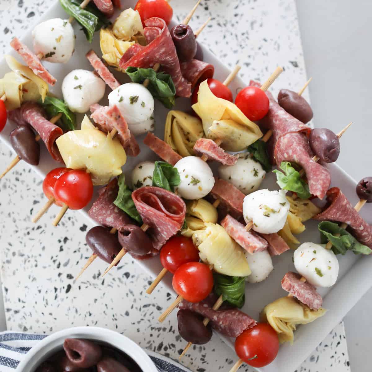 antipasto skewers recipe looking down on a white platter