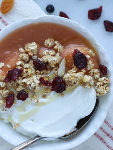 instant pot apple sauce in a bowl with yogurt and granola