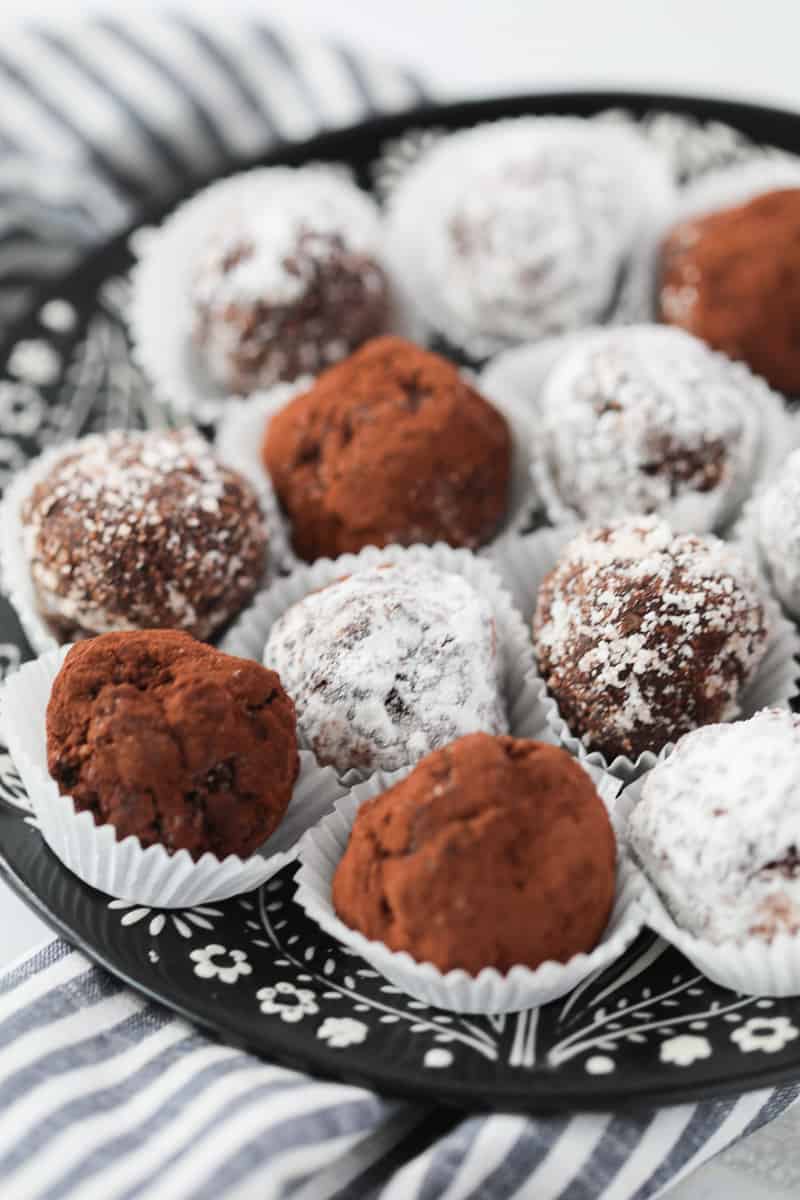 keto candy recipes like low carb rum balls covered with coconut in a white wrapper