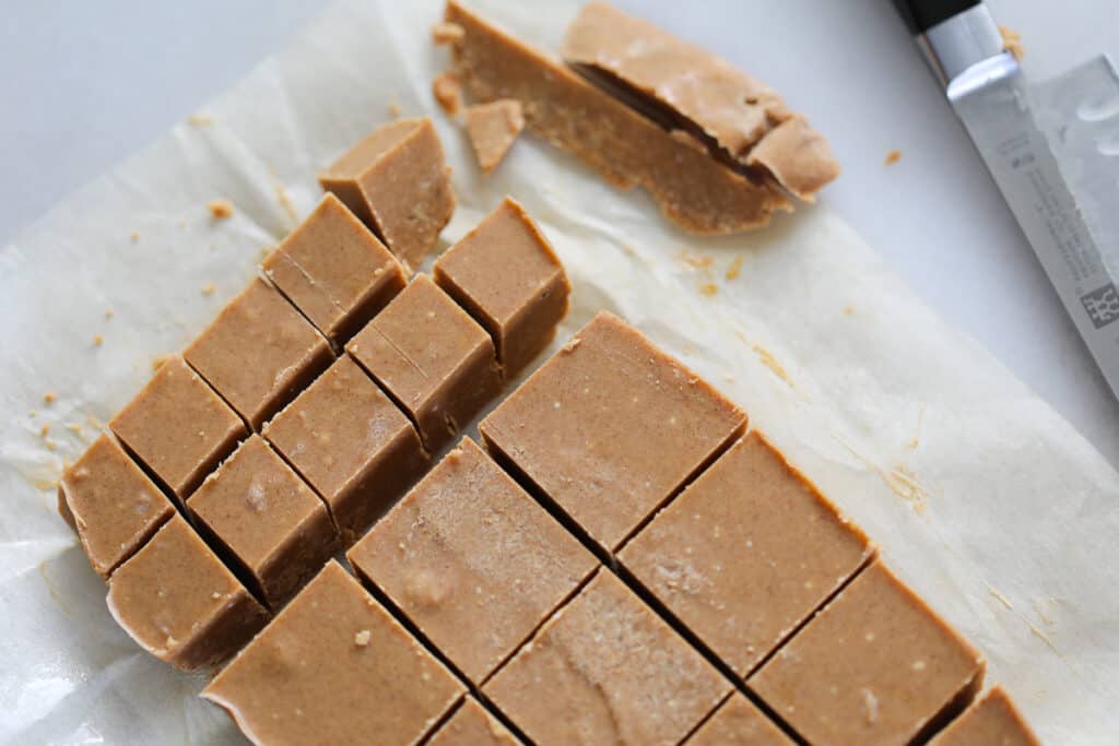 the low carb peanut butter fudge cut into different sized squares