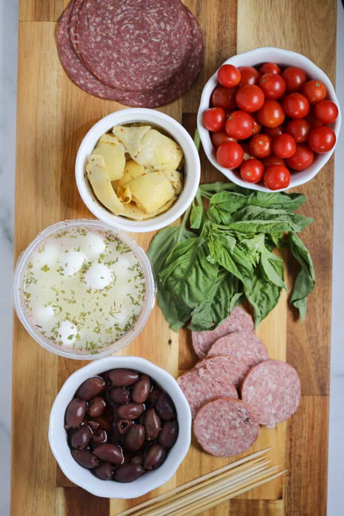 mini antipasto skewers ingredients on a cutting board