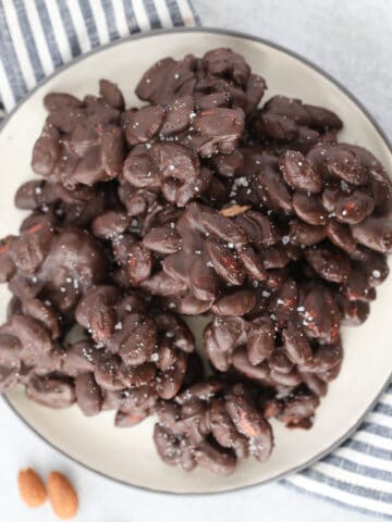 sugar free chocolate covered almonds on a white plate