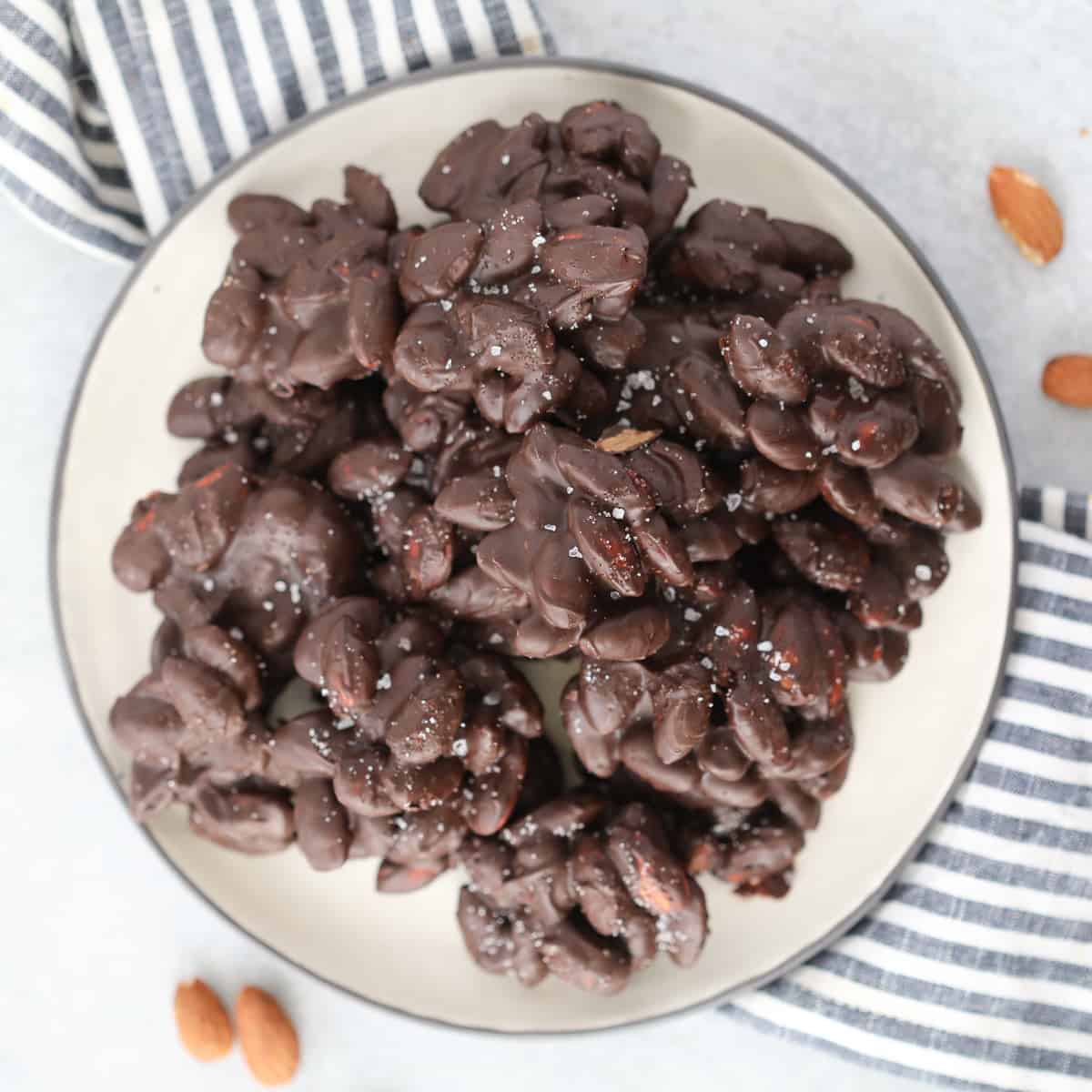 sugar free chocolate covered almonds on a white plate