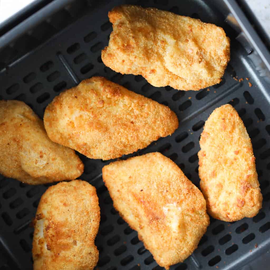 frozen cod or frozen fish air fryer recipe with the fish in the basket after cooking