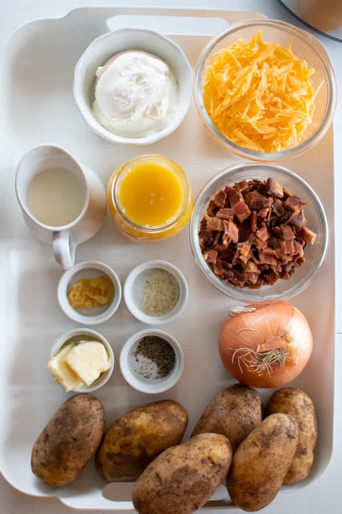instant pot baked potato soup ingredients on a white tray