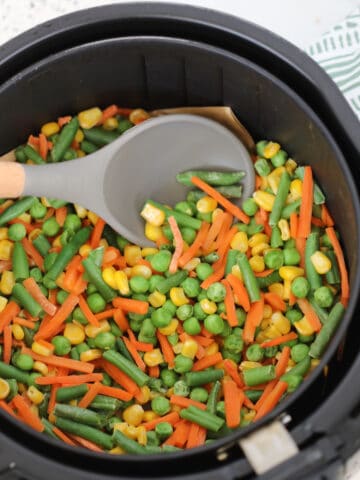 air fryer frozen vegetables medley getting stirred