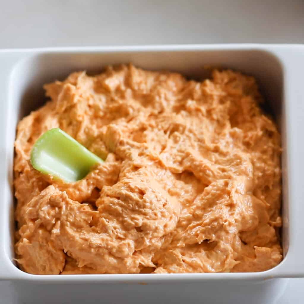the buffalo chicken dip keto recipe in a white dish