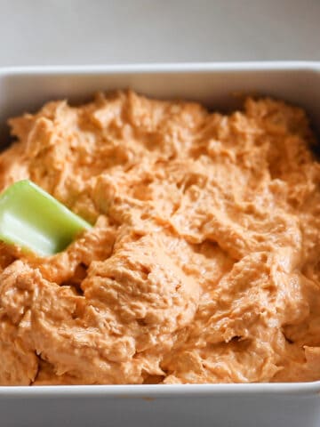 the buffalo chicken dip keto recipe in a white dish