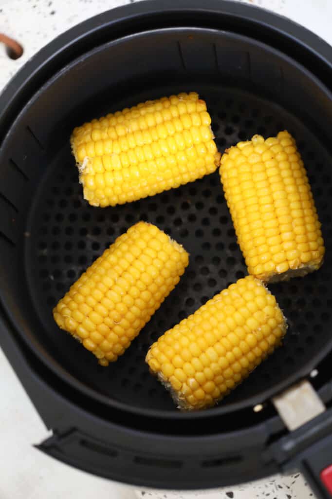 frozen corn on the cob air fryer recipe after cooking resting in the air fryer