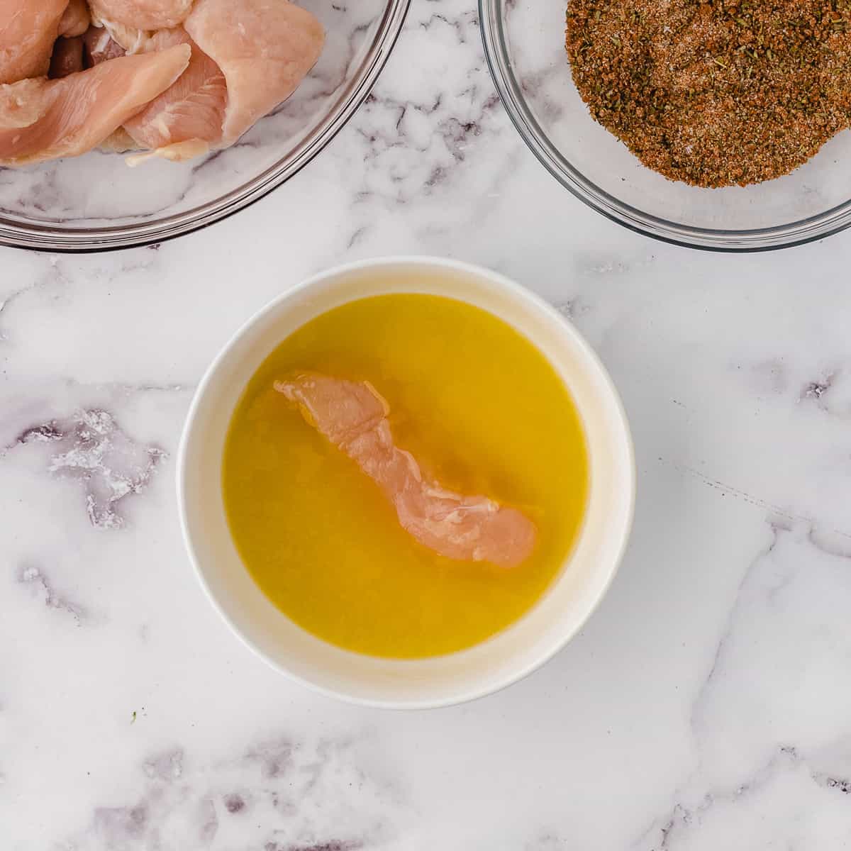 dipping chicken tenderloins in butter for baked chicken tenders