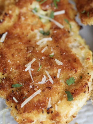 breaded and baked chicken cutlets in oven close up photo after cooking