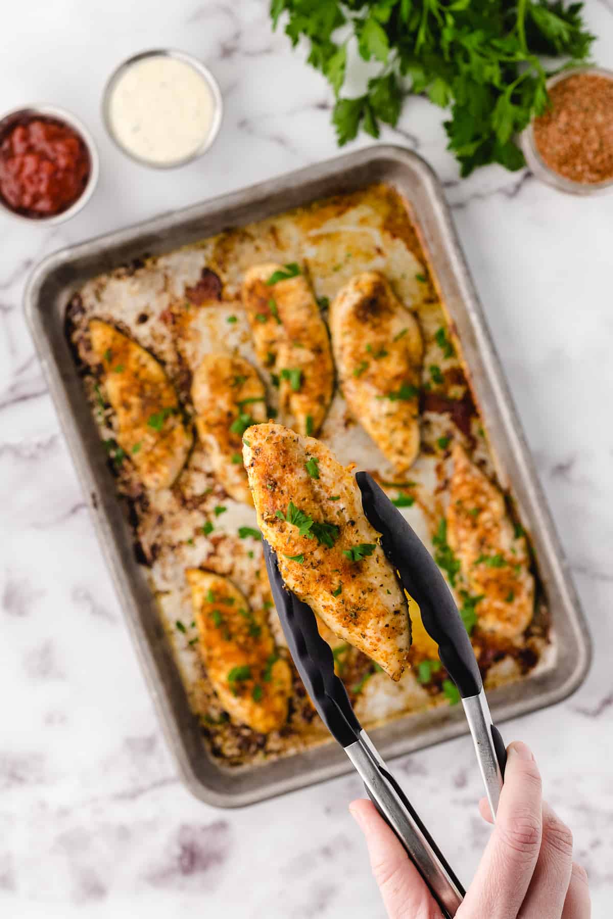 chicken tenderloin recipe on a sheet pan