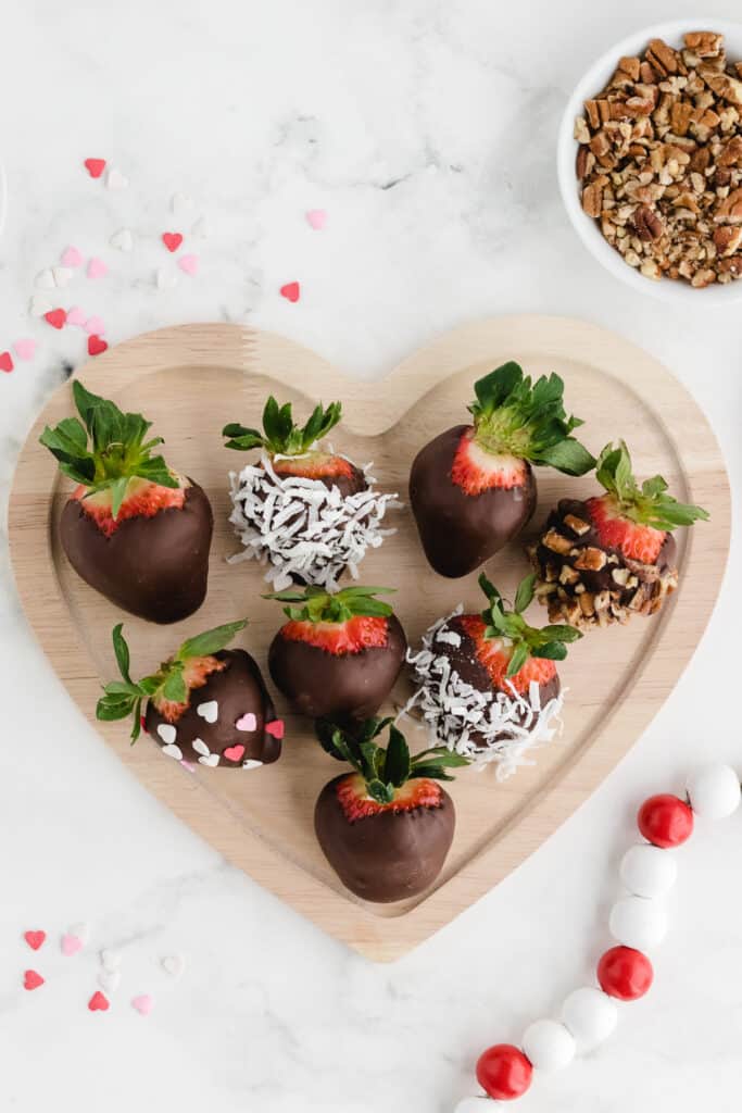 chocolate covered strawberries for valentine's day on a heart shaped dish