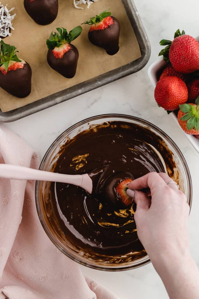 how to make chocolate covered strawberries getting dipped in melted chocolate
