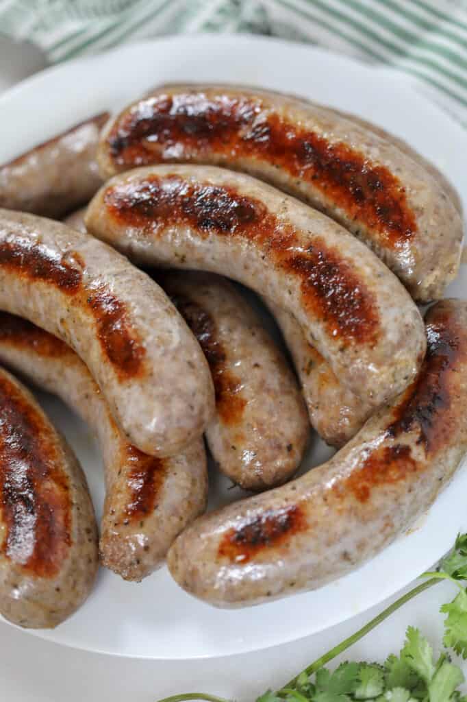 learn how to  boil italian sausage before grilling or pan frying