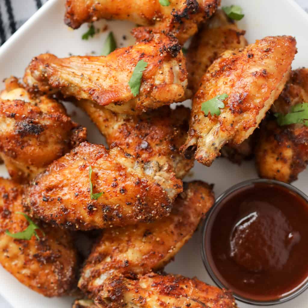 dry rub baked chicken wings on a plate after cooking