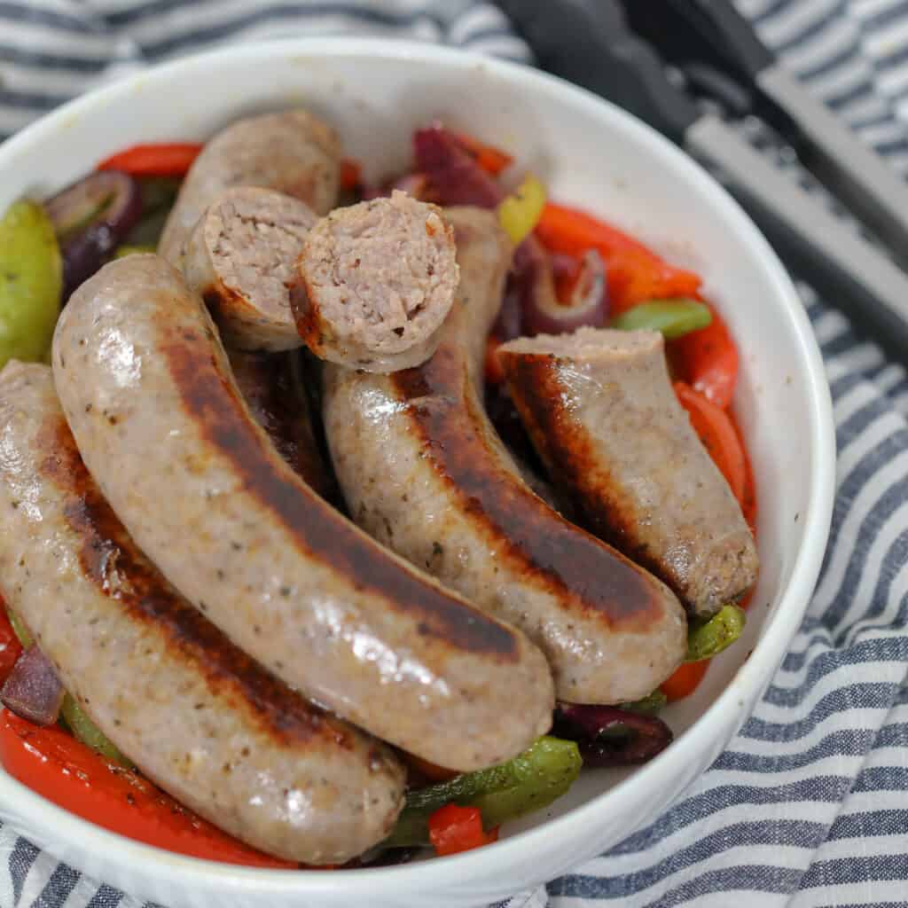 pan fried italian sausage with a link sliced in half after cooking