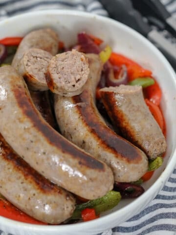 pan fried italian sausage with a link sliced in half after cooking