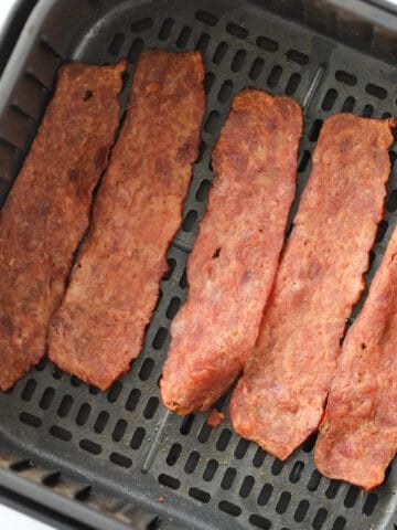 the turkey bacon in air fryer recipe sitting in the basket after cooking