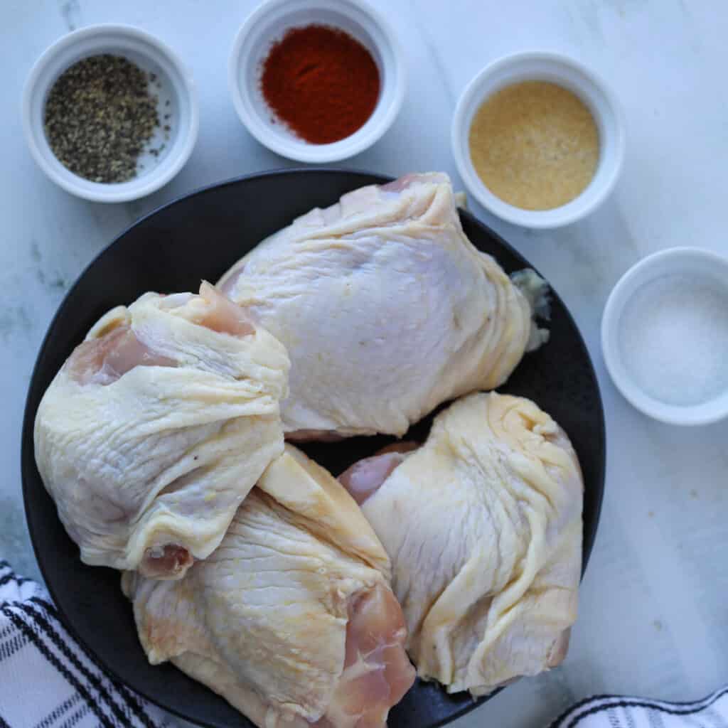 how long to cook chicken thighs on the stove starts with gathering the recipe ingredients, bone in skin on chicken thighs with spices