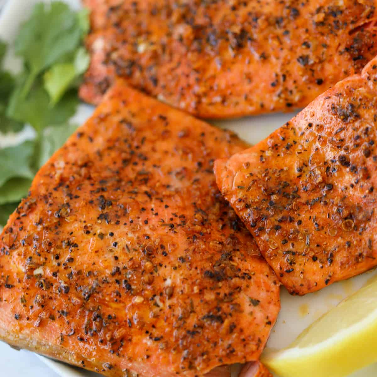the frozen salmon in air fryer close up on a white plate