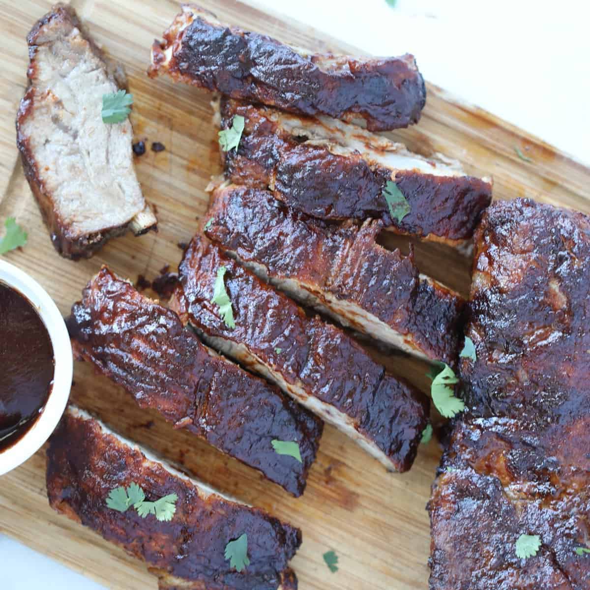 air fryer ribs cut into tender sections after cooking between the bones