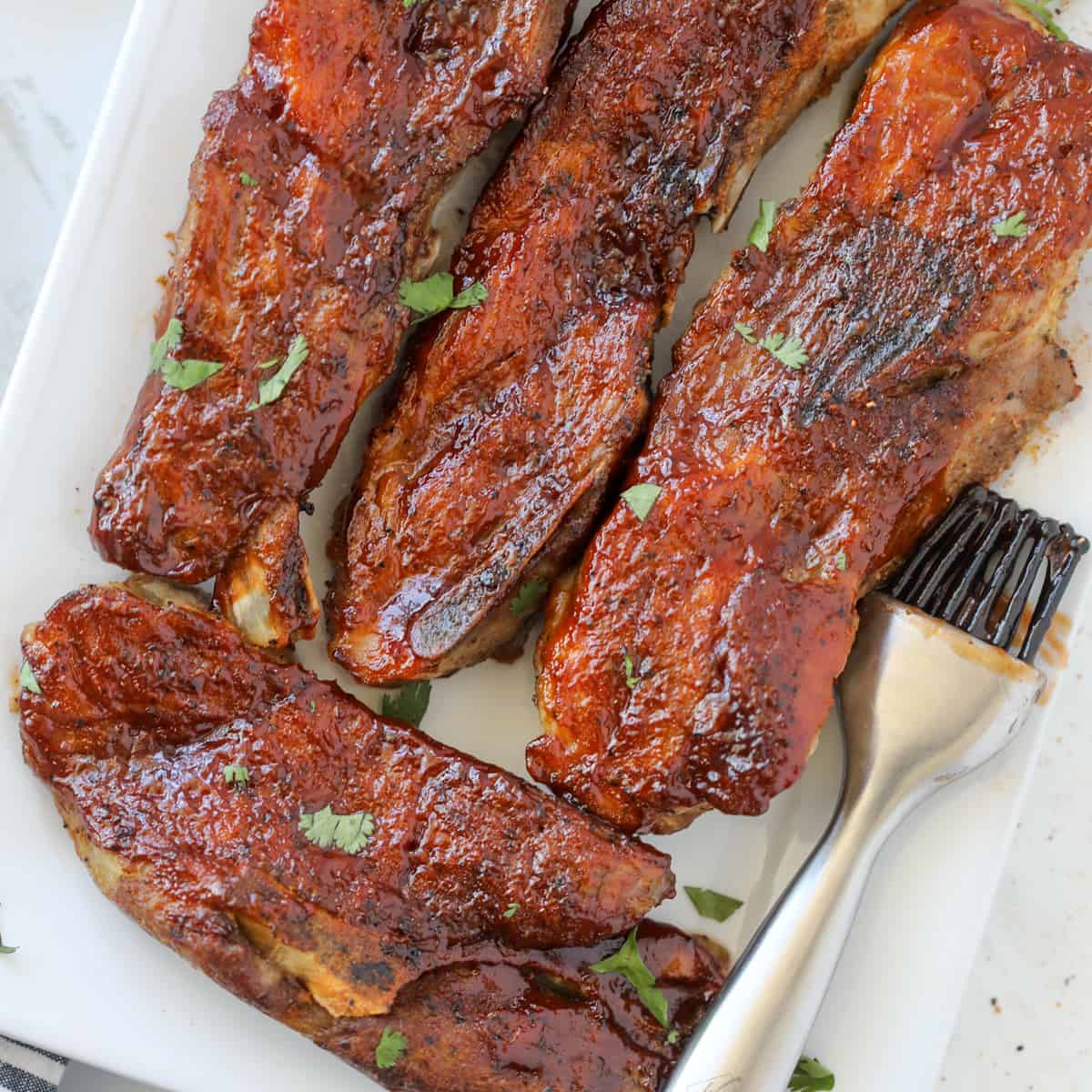 country style ribs in air fryer after cooking brushed with sauce