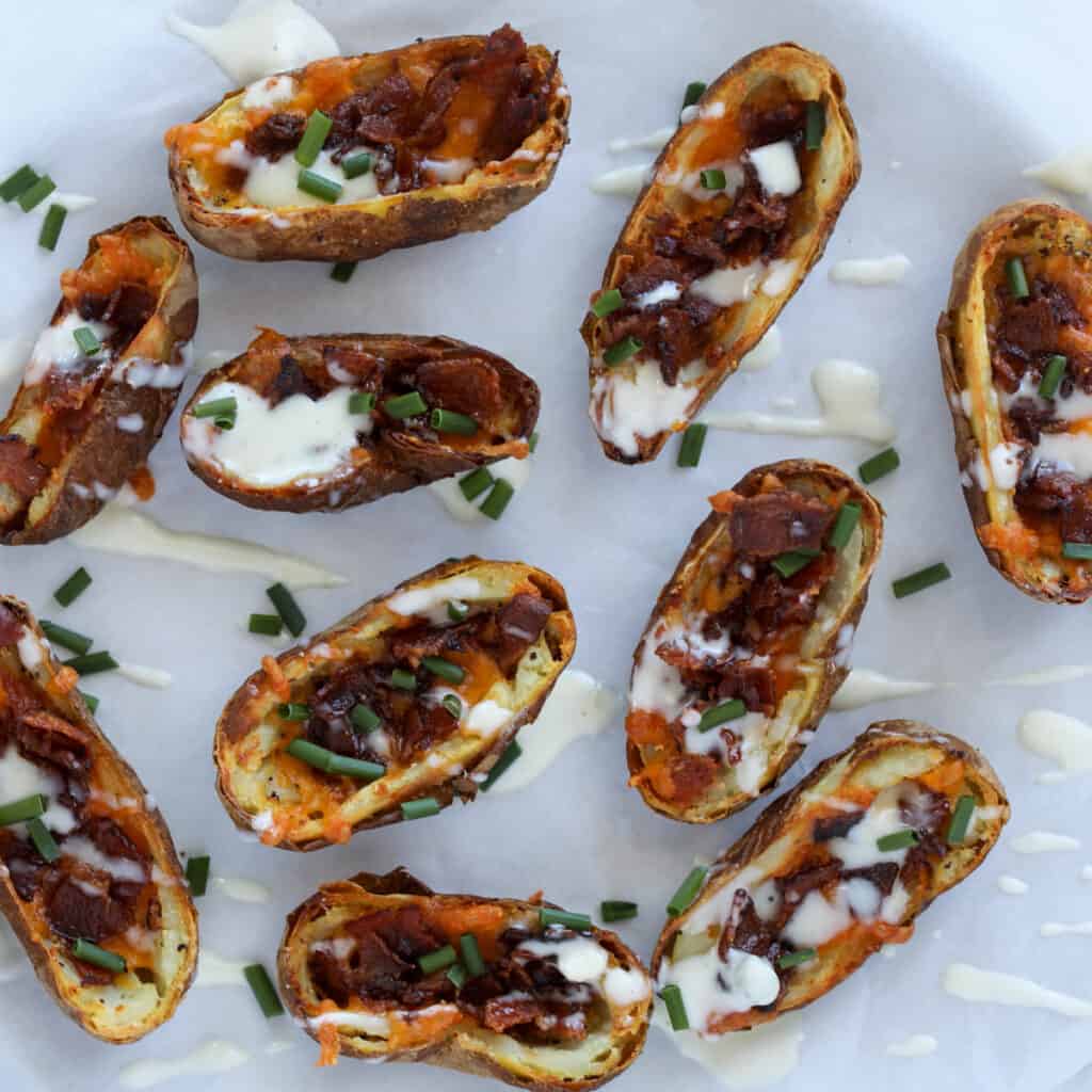 potato skins in air fryer on a plate after cooking