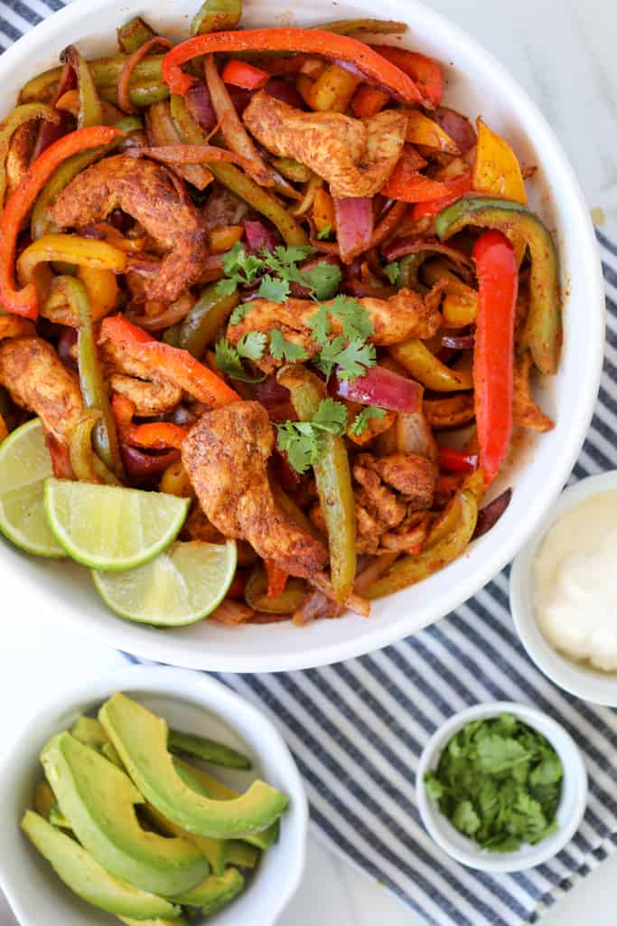 air fryer chicken fajitas after cooking in a white bowl