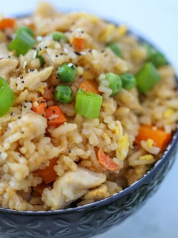 chicken fried rice air fryer recipe with garnish in a bowl